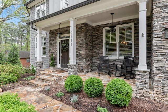 2811 Shady Valley Dr NE, Brookhaven, GA 30324 - view of exterior entry featuring covered porch and stone siding