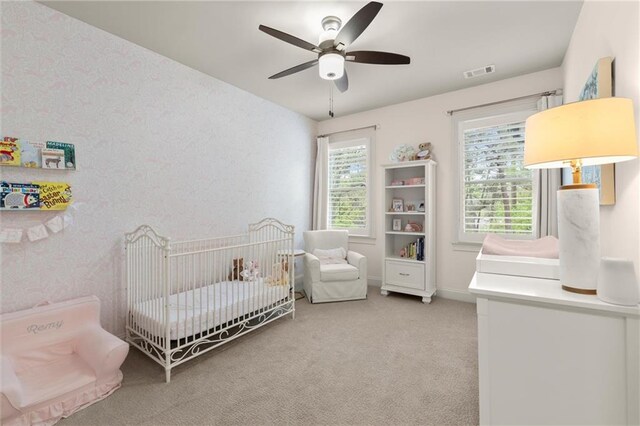 2811 Shady Valley Dr NE, Brookhaven, GA 30324 - bedroom with baseboards, light carpet, a ceiling fan, and visible vents