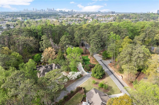 2811 Shady Valley Dr NE, Brookhaven, GA 30324 - back of property with a sunroom, a fenced backyard, a lawn, and a chimney