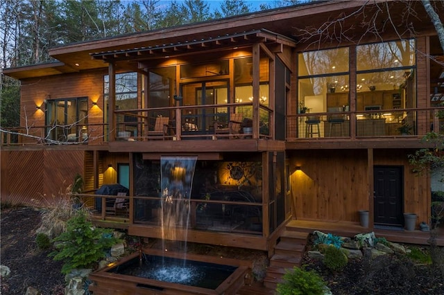 303 Clarice Ln, Sautee Nacoochee, GA 30571 - rear view of house featuring a sunroom