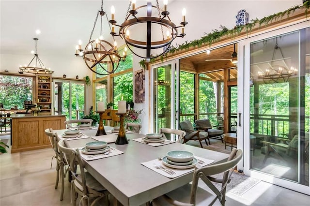 303 Clarice Ln, Sautee Nacoochee, GA 30571 - dining area featuring a chandelier, healthy amount of natural light, and light tile patterned floors