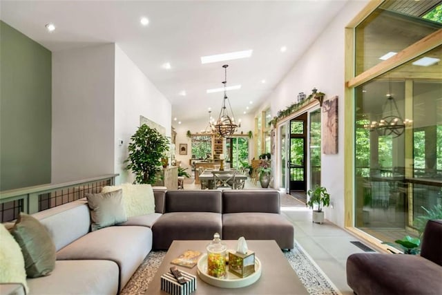 303 Clarice Ln, Sautee Nacoochee, GA 30571 - tiled living room with a chandelier, a skylight, and recessed lighting