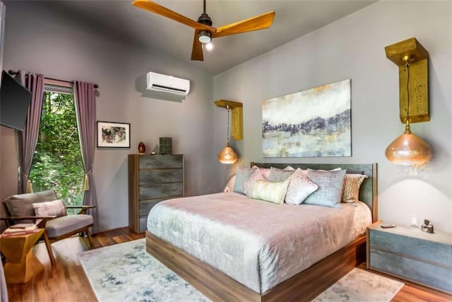 303 Clarice Ln, Sautee Nacoochee, GA 30571 - bedroom featuring an AC wall unit, wood finished floors, vaulted ceiling, and ceiling fan
