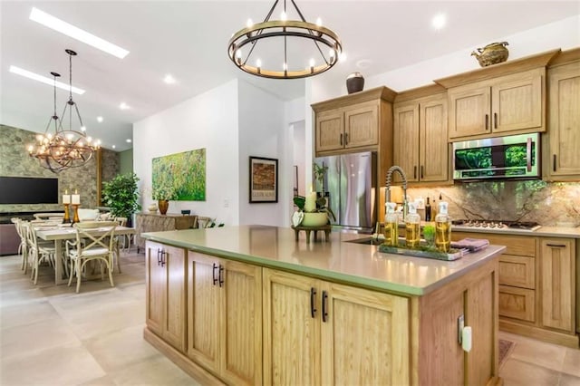 303 Clarice Ln, Sautee Nacoochee, GA 30571 - kitchen featuring stainless steel appliances, a chandelier, decorative backsplash, an island with sink, and open floor plan
