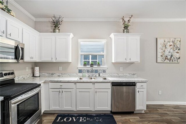 kitchen featuring white cabinets, stainless steel appliances, dark wood-style floors, and a sink