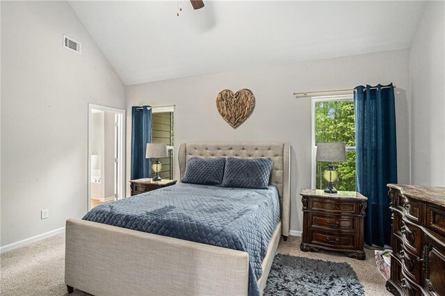 bedroom with visible vents, baseboards, carpet floors, and lofted ceiling