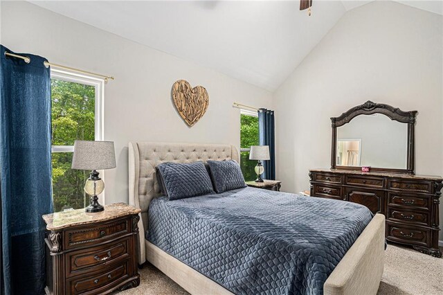 bedroom with carpet floors, ceiling fan, and lofted ceiling