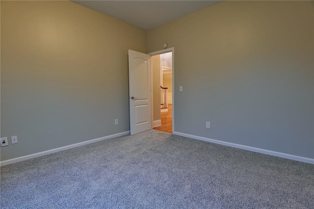 unfurnished room with carpet floors