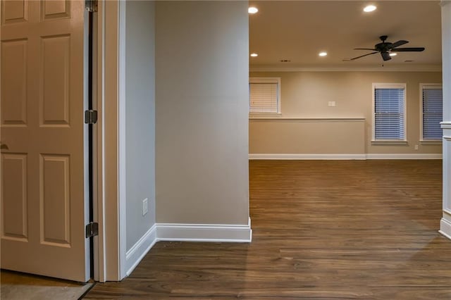 spare room featuring ornamental molding, ceiling fan, and dark hardwood / wood-style flooring