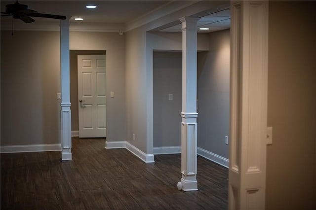 basement with dark hardwood / wood-style flooring, crown molding, and ceiling fan