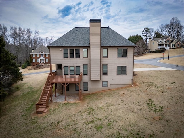 rear view of property with a wooden deck