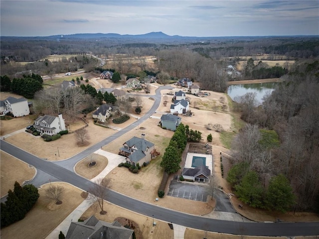 aerial view featuring a water and mountain view