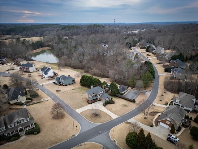 aerial view at dusk with a water view