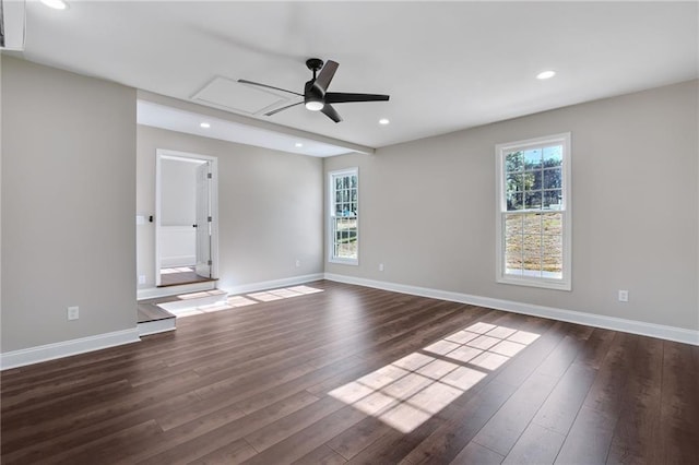 unfurnished room with dark wood-style floors, baseboards, and recessed lighting