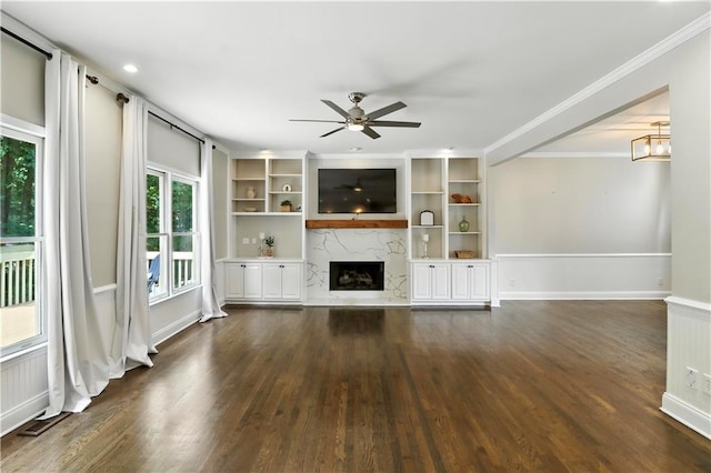 5807 Brookstone Walk NW, Acworth, GA 30101 - unfurnished living room featuring a fireplace, dark wood-style flooring, ornamental molding, and ceiling fan