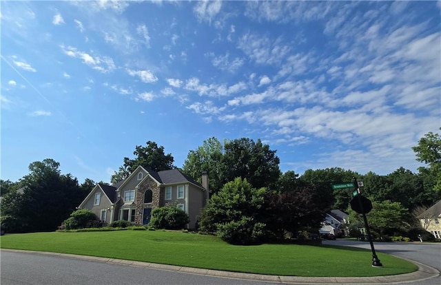 5807 Brookstone Walk NW, Acworth, GA 30101 - view of front of house with a front lawn, stone siding, and a chimney