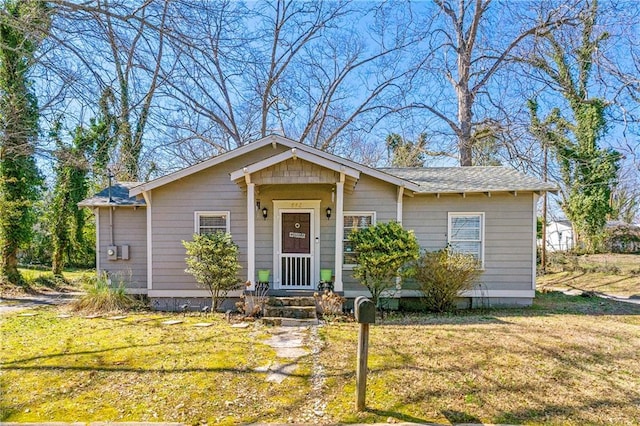 bungalow with a front yard