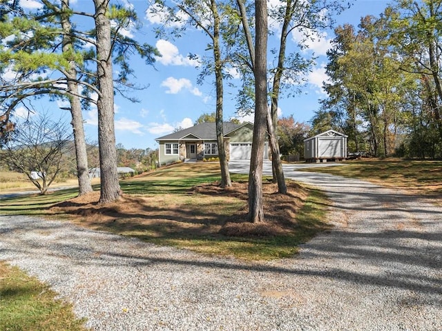 view of front of home with a storage shed and a front yard