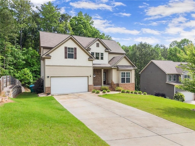 view of front of property featuring brick siding, driveway, an attached garage, and a front lawn