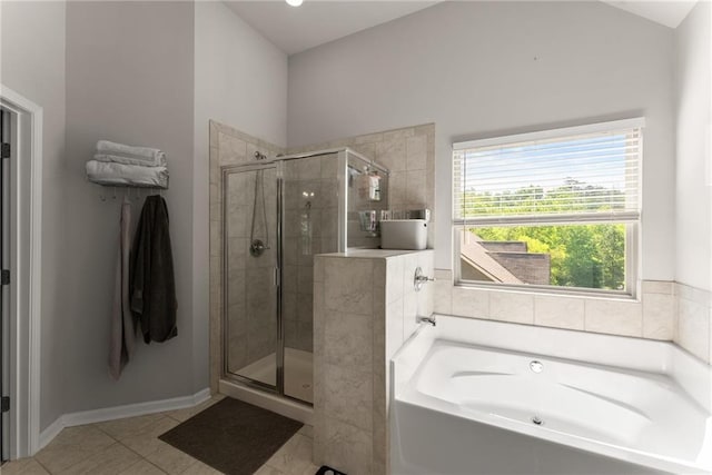 full bath with a stall shower, a bath, tile patterned floors, and baseboards