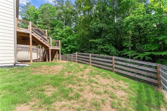 view of yard featuring stairs and a wooden deck