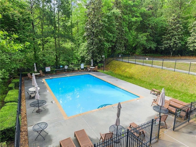 community pool with a patio area