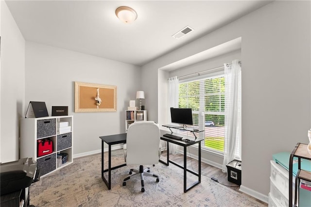 office space featuring baseboards