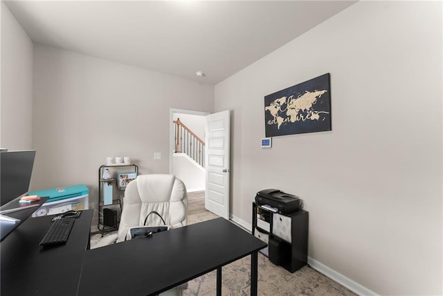 office space with baseboards