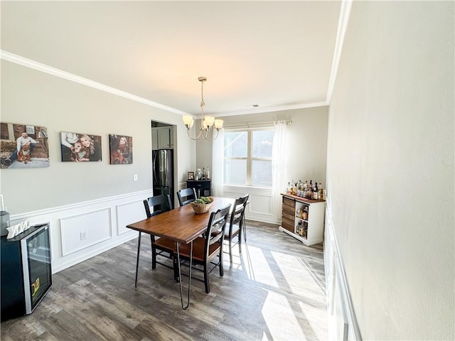 275 Creek View Pl, Canton, GA 30114 - dining area featuring a chandelier, ornamental molding, beverage cooler, wood finished floors, and a wainscoted wall