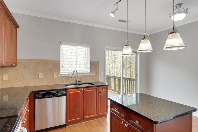 kitchen with light wood finished floors, tasteful backsplash, stainless steel dishwasher, ornamental molding, and a sink