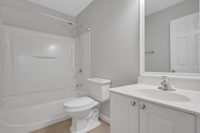 bathroom with washtub / shower combination, vanity, toilet, and tile patterned floors