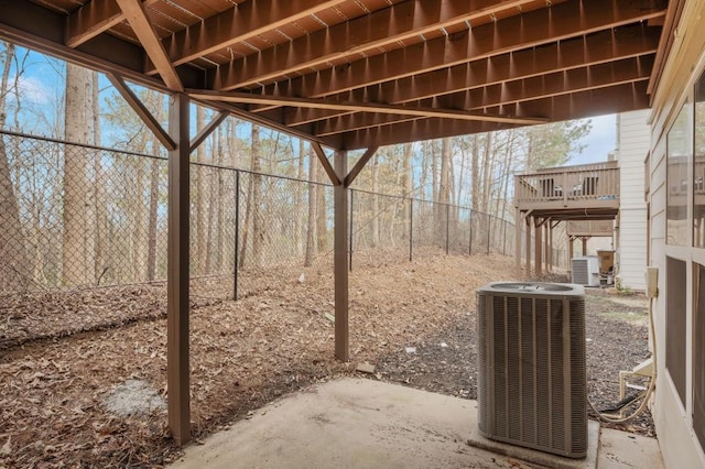 view of patio with fence and central AC unit