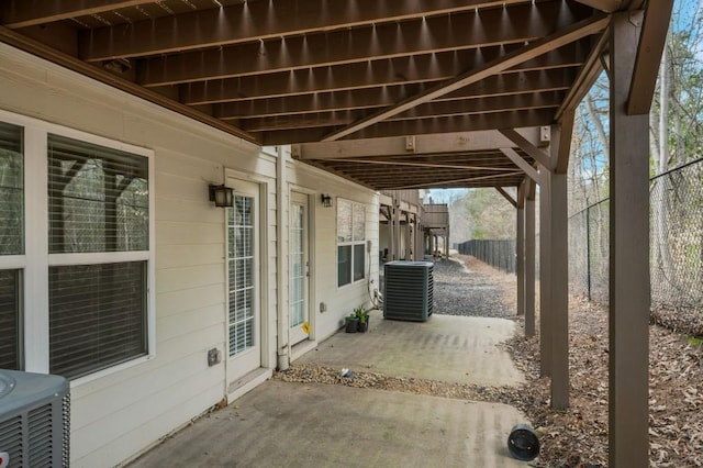 view of patio / terrace with central AC and fence