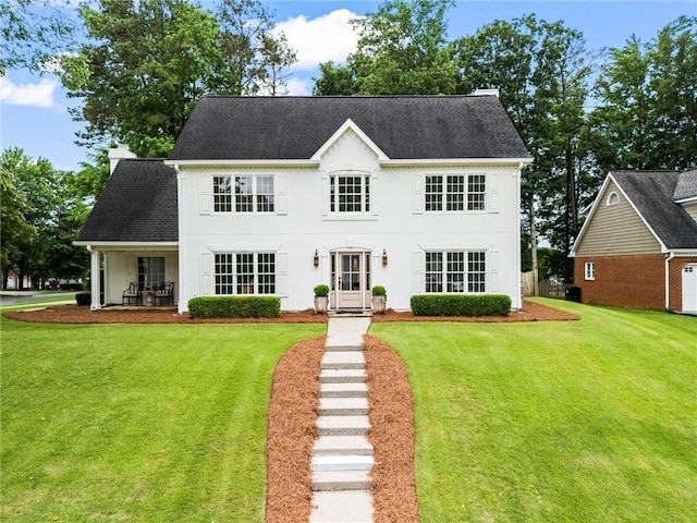 600 Delphinium Blvd NW, Acworth, GA 30102 - view of front of property with a front yard, a chimney, and roof with shingles