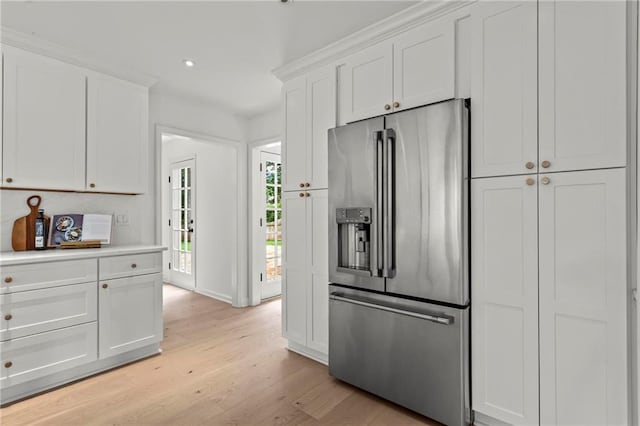 600 Delphinium Blvd NW, Acworth, GA 30102 - kitchen featuring high end fridge, light wood finished floors, white cabinetry, baseboards, and recessed lighting