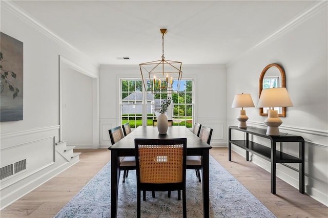 600 Delphinium Blvd NW, Acworth, GA 30102 - dining room with a chandelier, crown molding, and light wood finished floors