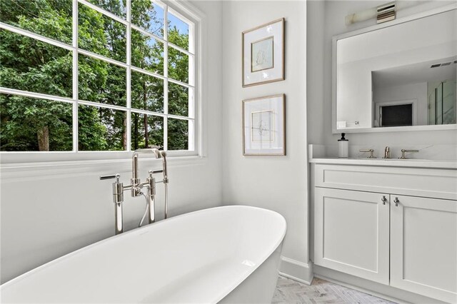 600 Delphinium Blvd NW, Acworth, GA 30102 - bathroom featuring vanity and a freestanding tub