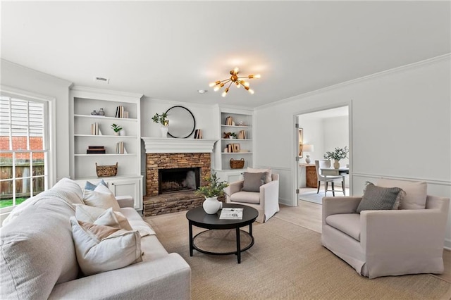 600 Delphinium Blvd NW, Acworth, GA 30102 - living room featuring a chandelier, ornamental molding, a stone fireplace, and built in shelves