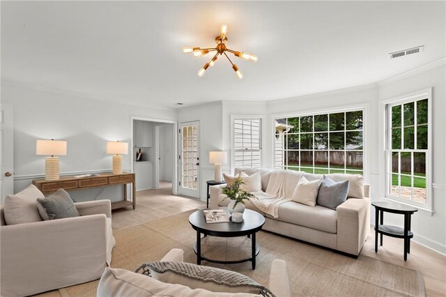 600 Delphinium Blvd NW, Acworth, GA 30102 - living area with crown molding, a chandelier, and baseboards