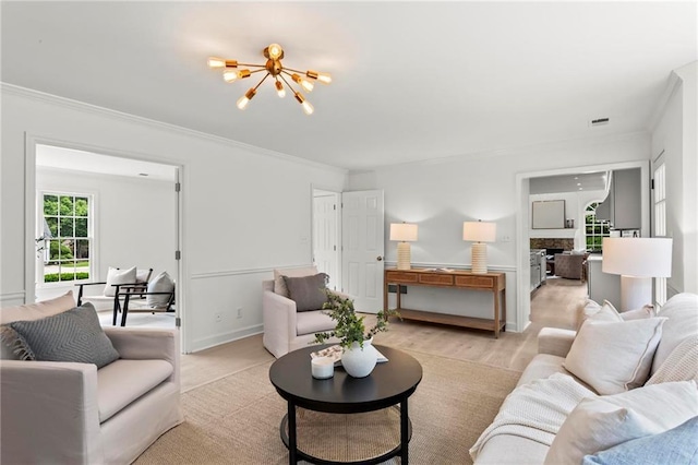 600 Delphinium Blvd NW, Acworth, GA 30102 - living room with a chandelier, ornamental molding, and light wood finished floors