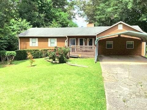 2691 Tucson Way, Powder Springs, GA 30127 - ranch-style home featuring a front yard, concrete driveway, an attached carport, a chimney, and covered porch