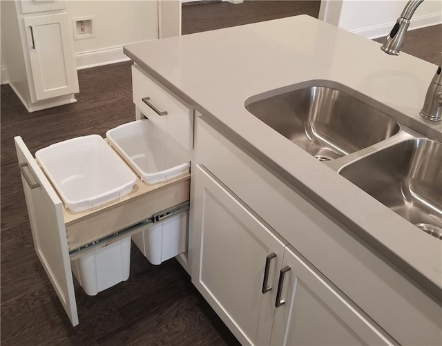 kitchen featuring white cabinetry, sink, and dark hardwood / wood-style flooring