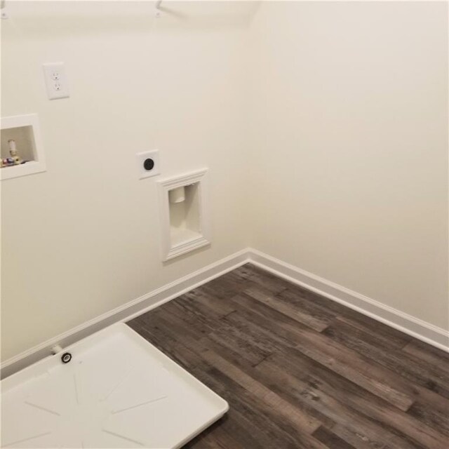 washroom featuring washer hookup, dark wood-type flooring, and hookup for an electric dryer