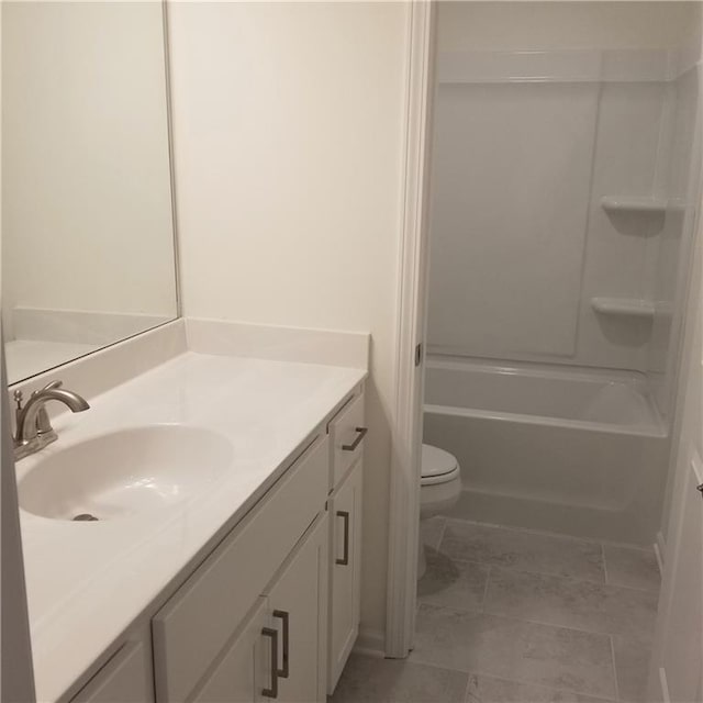 full bathroom with vanity, toilet, and washtub / shower combination