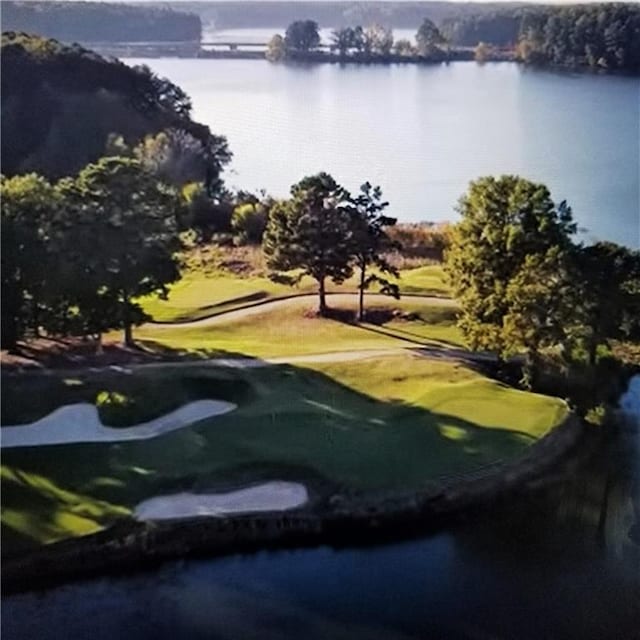 surrounding community featuring a water view