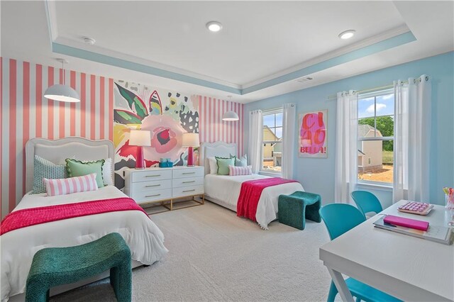 bedroom featuring multiple windows, a raised ceiling, and carpet floors