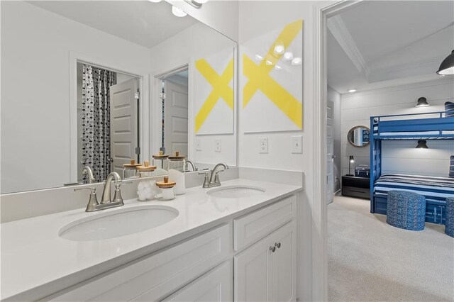 bathroom with vanity and ornamental molding