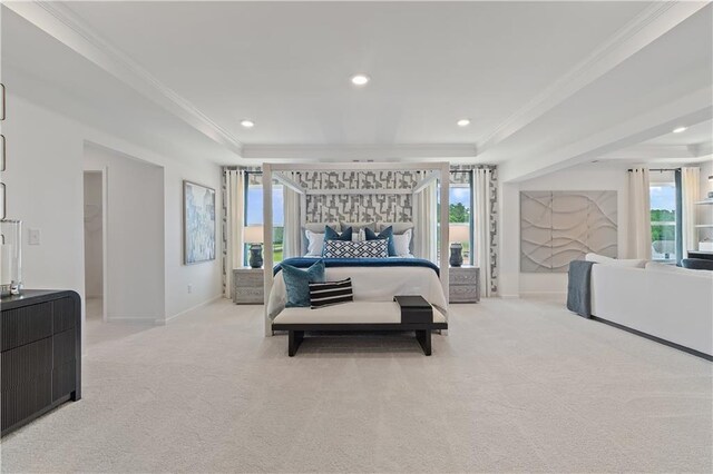 carpeted bedroom featuring a walk in closet and crown molding