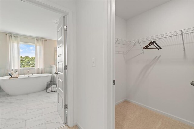 bathroom featuring a tub to relax in