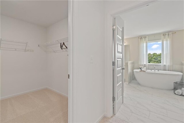 bathroom featuring a tub to relax in